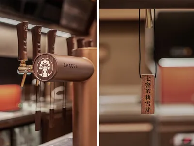 Close-up of wooden coffee shop interior design elements, featuring wooden taps and a hanging wooden sign.