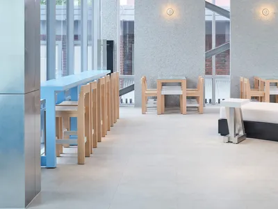 A minimalist restaurant interior with wood accents.
