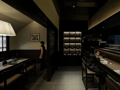 A modern restaurant interior with dark wood and black metal accents, glass shelves, and a minimalist design.