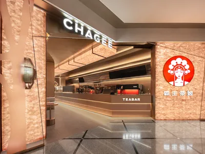 Modern restaurant interior with metallic finishes and minimalist design.