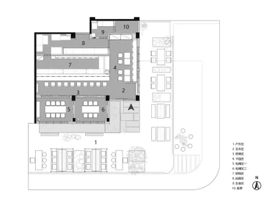 Floor plan of an industrial-themed restaurant featuring concrete elements and open seating.