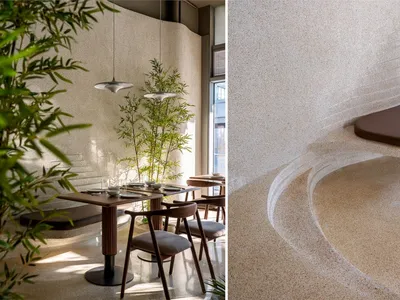 Modern restaurant interior with concrete flooring and seating