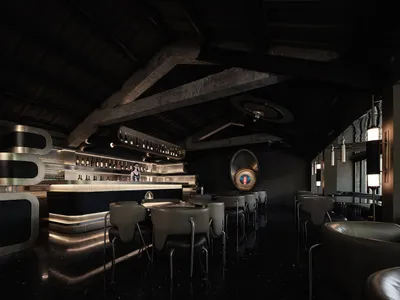 A dimly lit industrial restaurant bar with black decor and modern seating.