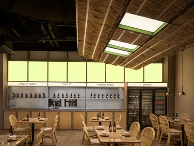 Interior design featuring bamboo and concrete elements in a restaurant space