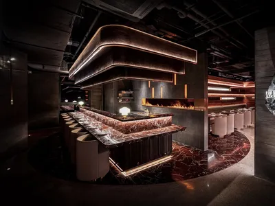 An industrial-style restaurant with a modern marble countertop