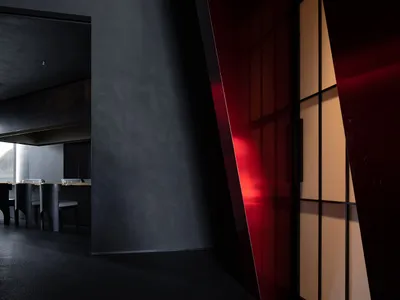 A modern restaurant interior with metallic walls and a sleek design.