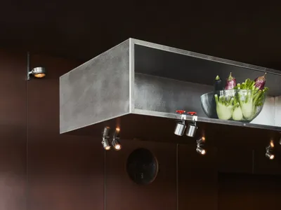 Modern minimalist kitchen with concrete countertops, featuring a sleek and contemporary design with clean lines and a monochr