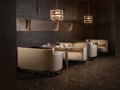 Modern restaurant interior with wooden walls, contemporary furniture, and ambient lighting.