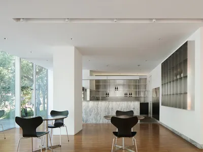 Modern kitchen with steel appliances and countertops