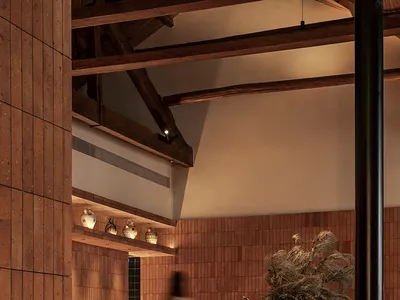A modern restaurant interior featuring wooden furniture and decor.