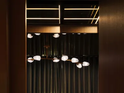 A modern restaurant interior featuring marble elements and industrial design.