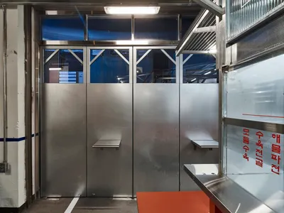 Industrial-themed restaurant interior featuring a metal counter