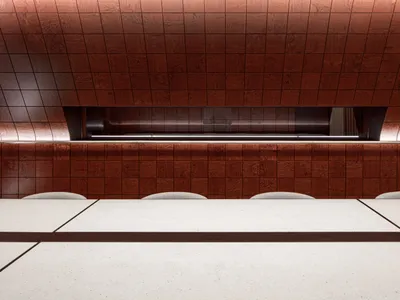 Modern restaurant interior with brick, concrete, and white features