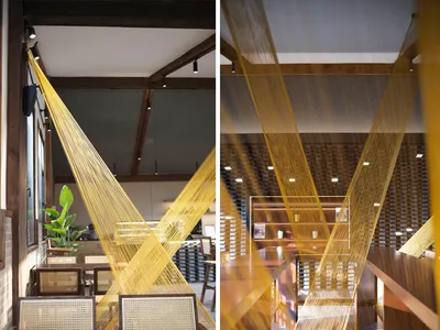An industrial-style restaurant with wooden features and a geometric design.