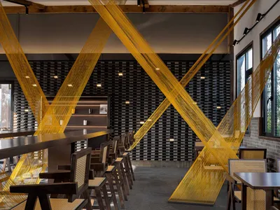 Modern restaurant interior design featuring contemporary materials and minimalist aesthetic