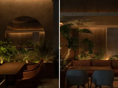 Industrial-themed restaurant seating area with concrete and wood materials.