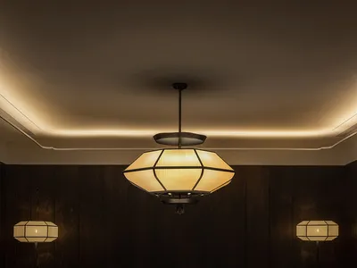A well-lit, modern restaurant dining room with wooden paneling, a round table, and elegant decor.