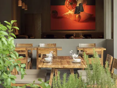 A modern restaurant interior with wooden furniture and an orange awning.