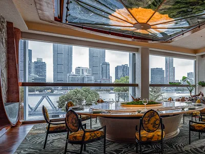 Modern restaurant booths overlooking a city skyline