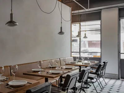 A modern restaurant dining area with sleek, contemporary design elements.