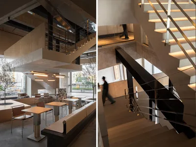 現代工業風餐廳室內，採用混凝土、玻璃與鋼材材質。
