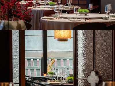 Modern restaurant interior featuring glass and wood materials