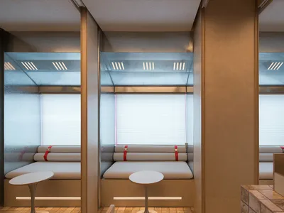Modern minimalist restaurant booths constructed from wood and a plastic composite material, providing a comfortable seating a