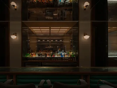A sleek, modern bar counter with a marble top.