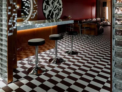 Modern restaurant interior with a metallic-texture bar counter.