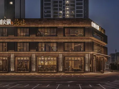 A modern restaurant exterior featuring glass walls and steel accents.