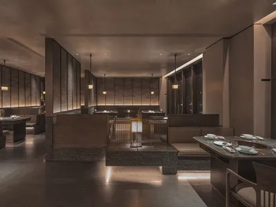 Modern restaurant interior with wooden features and stone accents