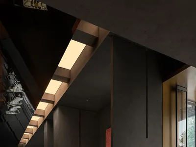 Contemporary restaurant interior with concrete, brass, and glass materials.