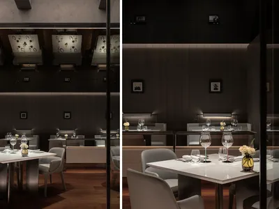 Modern restaurant interior with contemporary design elements, featuring lighting fixtures and sleek furnishings.