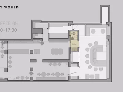 Floor plan of a coffee shop showing seating areas, tables, and a toilet.