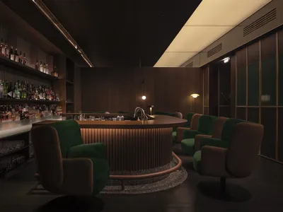 Contemporary bar area with wooden furniture and shelves filled with bottles, set in a restaurant interior with contemporary d