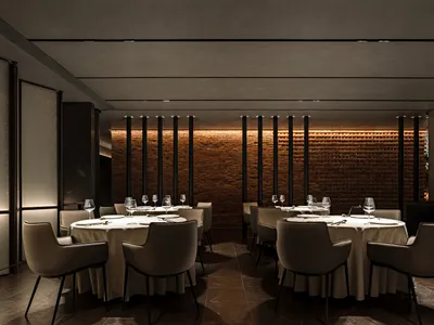 An industrial-style restaurant interior featuring brick walls.