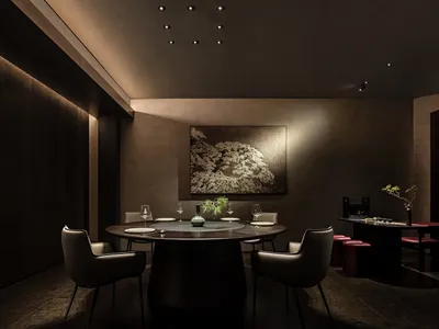 Modern restaurant dining room features metal, wood, and leather materials.