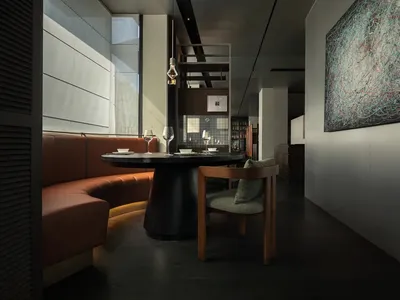 A modern restaurant interior featuring a round dining table with leather seating, a large abstract painting, and dark wooden