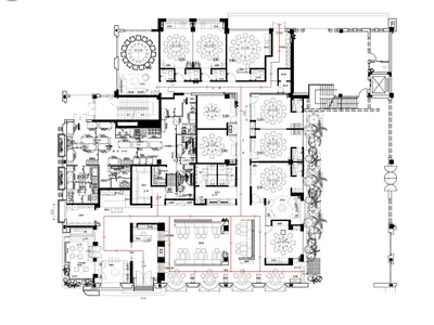 An architectural floor plan of a modern restaurant depicting various dining areas, seating arrangements, and kitchen layouts.