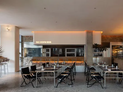 Modern restaurant interior with concrete walls and contemporary design elements