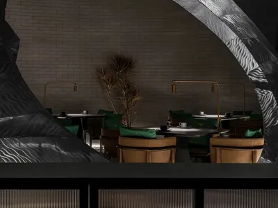 Industrial restaurant interior with metallic decor and seating