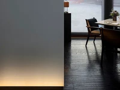 Modern, minimalist restaurant interior with large windows, wooden floors, and contemporary furniture.