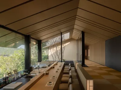 Modern restaurant bar with wooden walls and seating