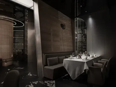 Modern restaurant with metal and wooden structures, glass walls, and elegant table setup
