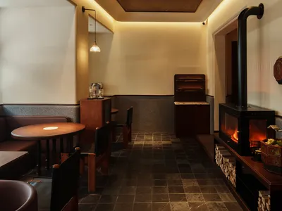 Industrial-style restaurant interior featuring wood materials.