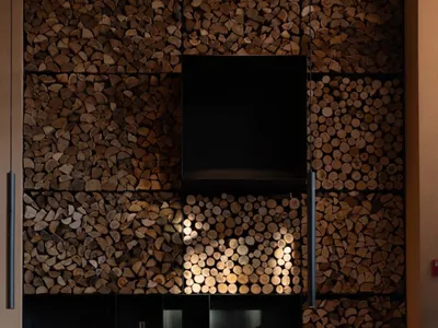 A cozy industrial restaurant interior with wood accents and seating arrangements