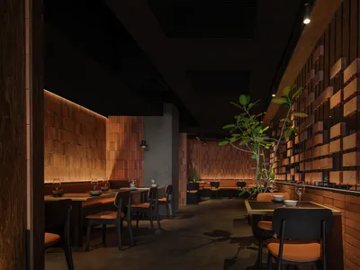 Modern restaurant interior with brick walls, wooden seating, and a minimalist design