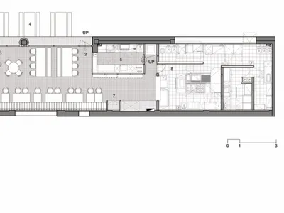 A black and white architectural floor plan of a modern restaurant interior.
