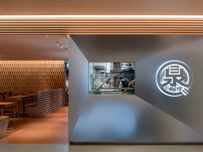 Modern noodle shop featuring sleek, minimalist design elements.