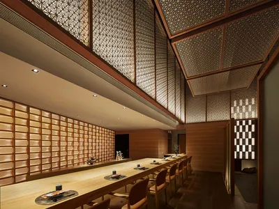 Modern restaurant interior with wooden walls, seating, and lighting fixtures.